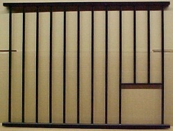 stall grill with feed opening